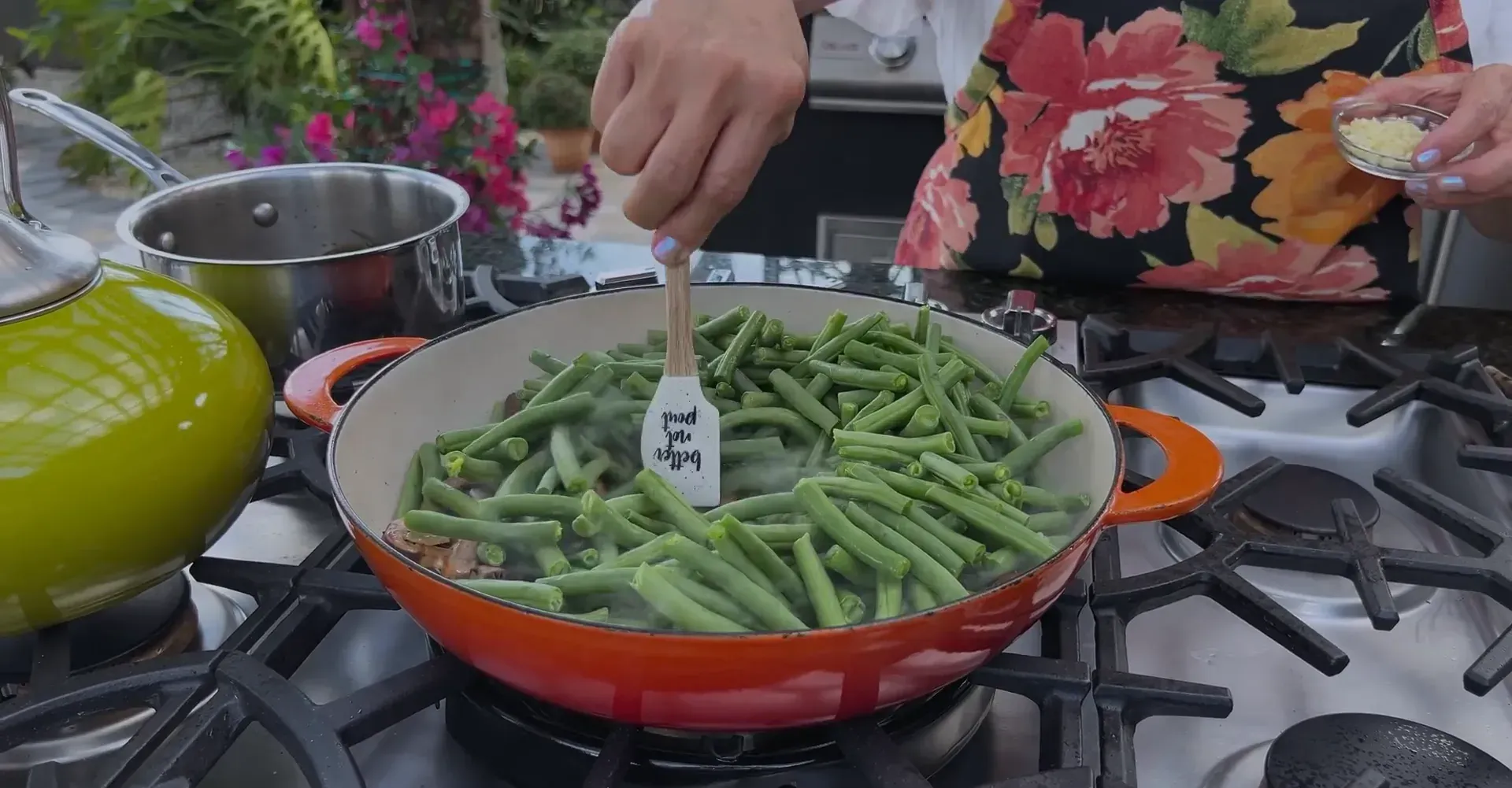 Adding green beans to the mixture