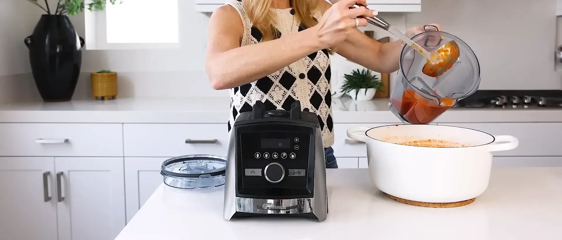 Ladling soup into blender