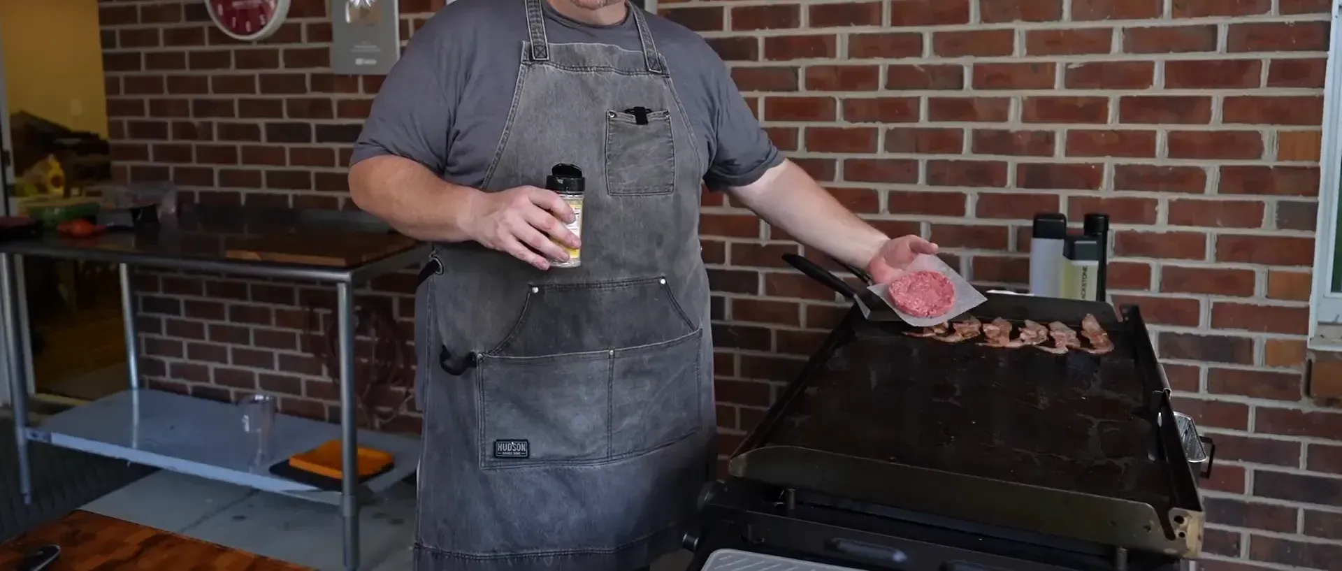 Seasoning the burger patties