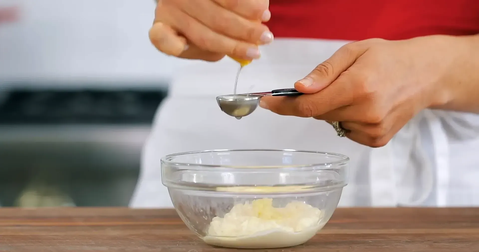 Adding lemon juice to the mixture.