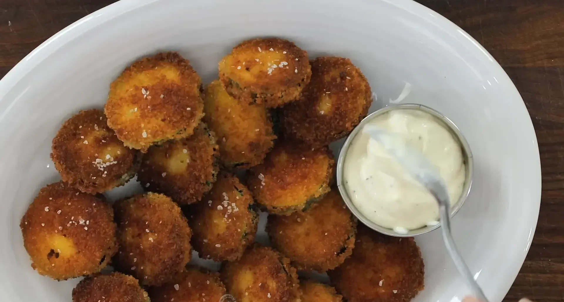 Serving zucchini chips with garlic aioli.