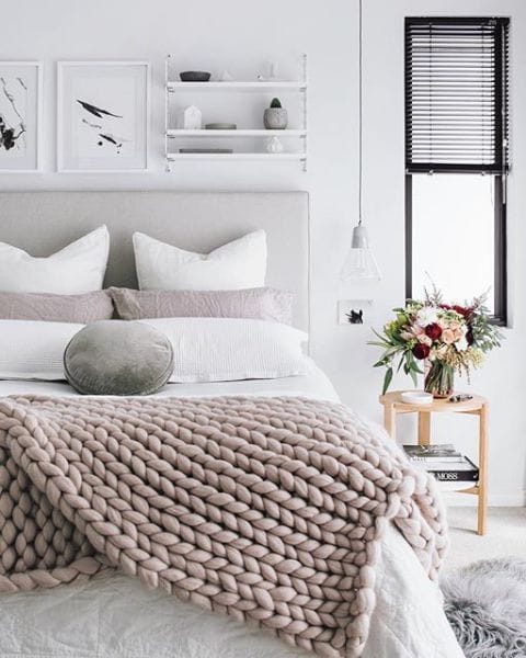 Cozy bedroom with chunky knit blankets