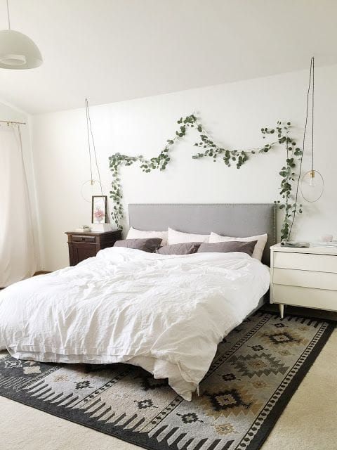 Cozy bedroom with eucalyptus garland