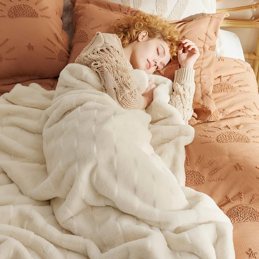 Bedroom bedding with faux fur throw