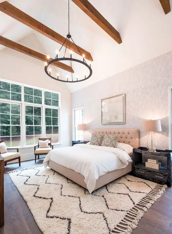 Cozy bedroom with wooden beam ceiling