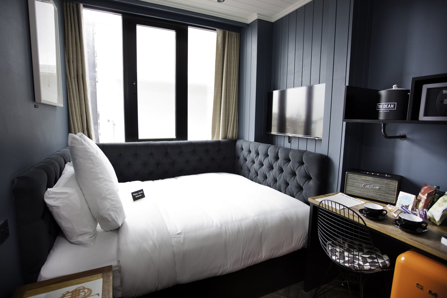 Try a wraparound headboard in your master bedroom