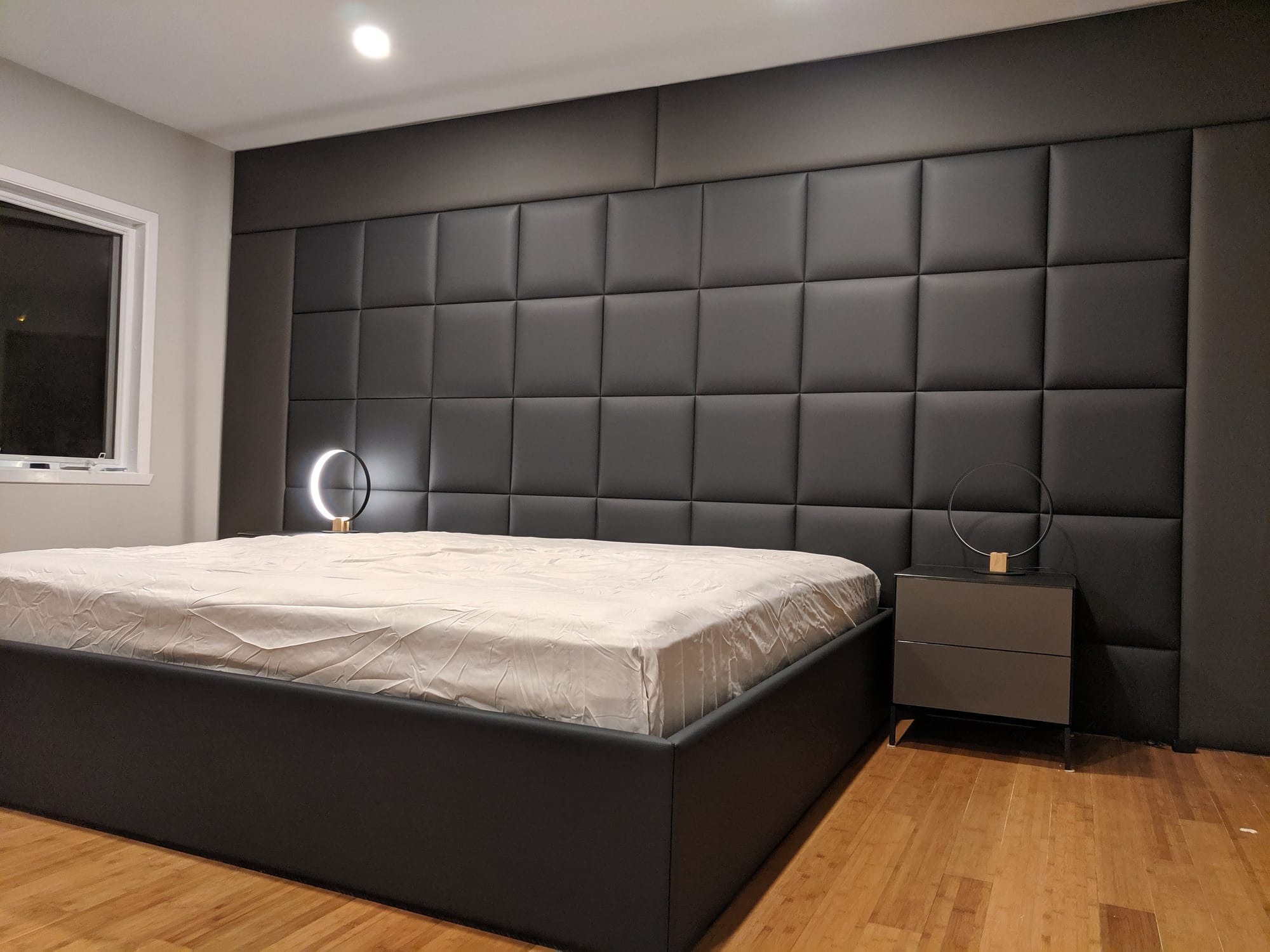 Bedroom wall with leather panel design