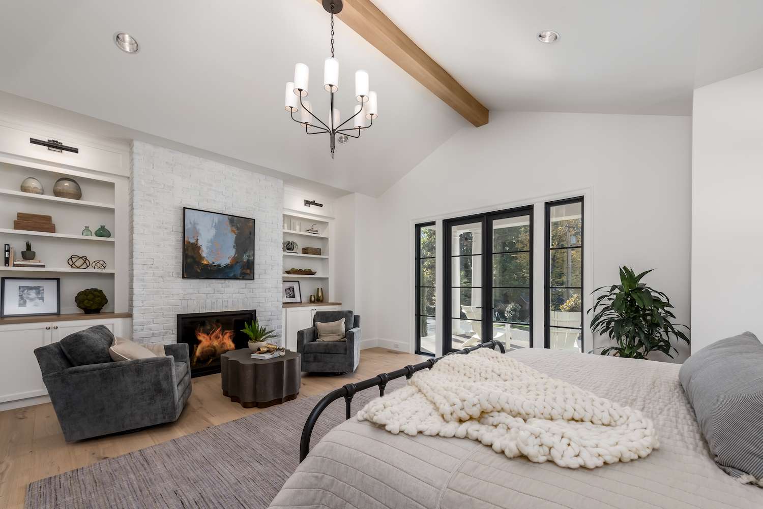 Large bedroom with fireplace seating