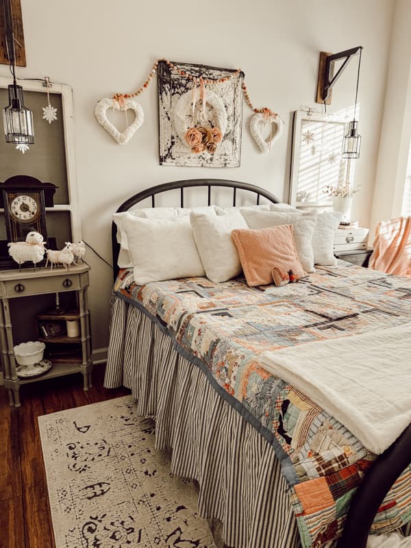 Cozy bedroom with vintage quilt display