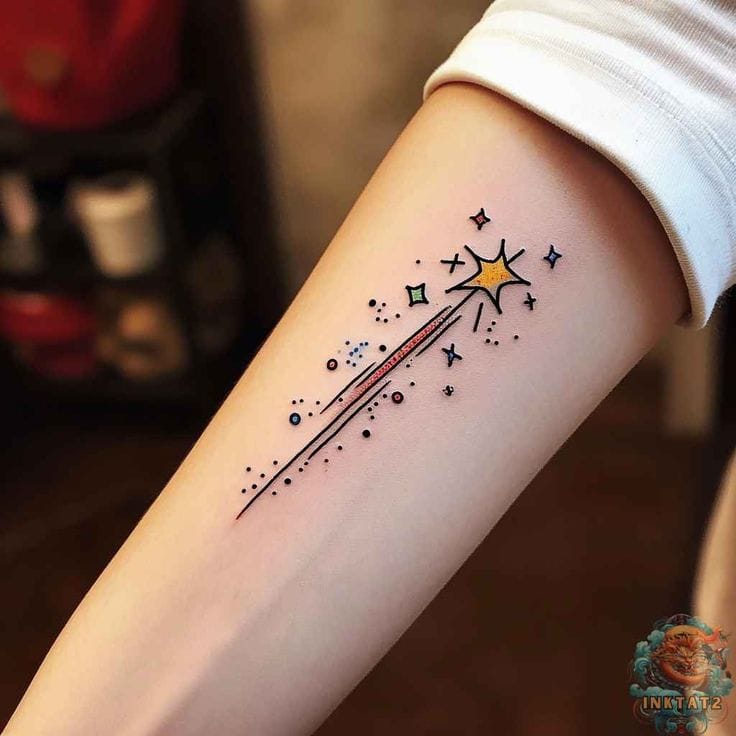 a sparkling shooting star tattoo with comet tail