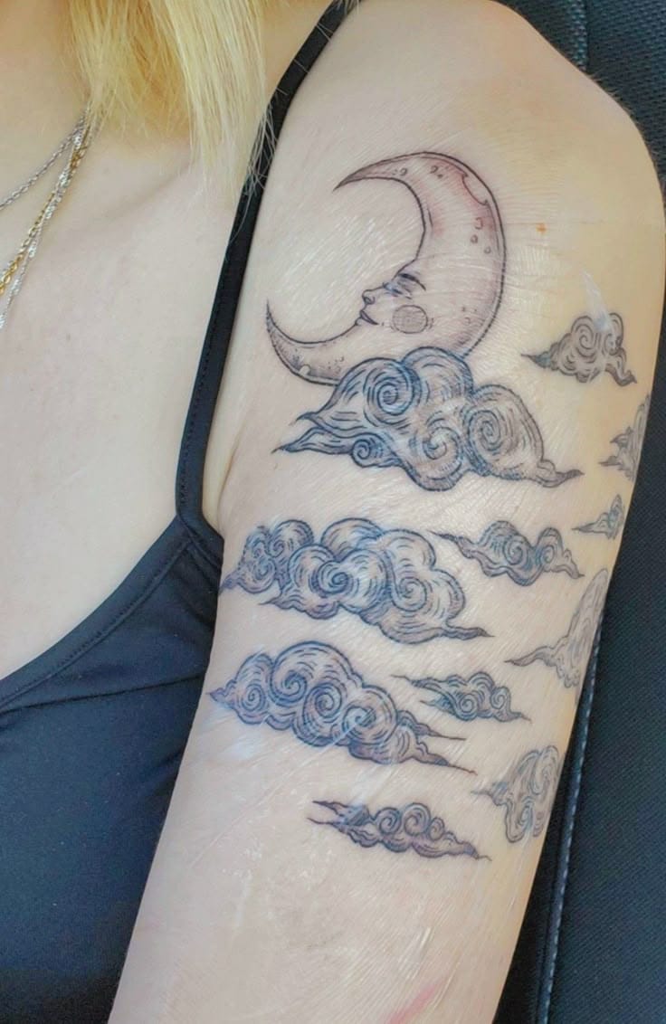 celestial cloud sleeve tattoo