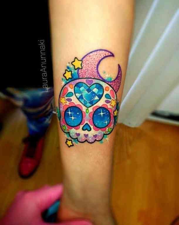 a dazzling glitter tattoo with a skull
