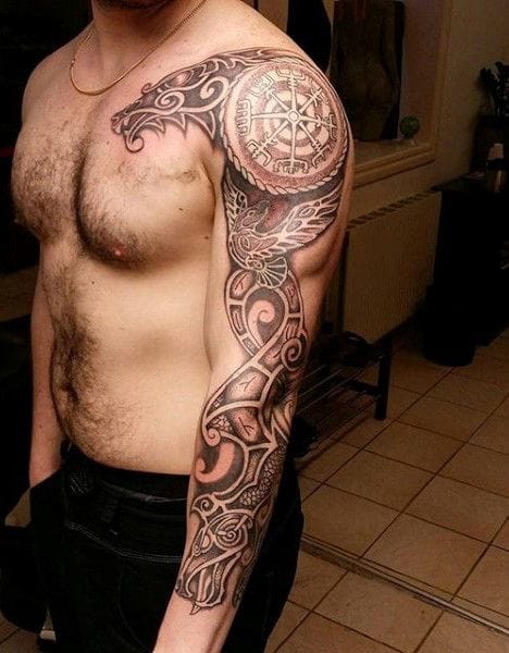 a masculine upper arm tattoo with Viking rune