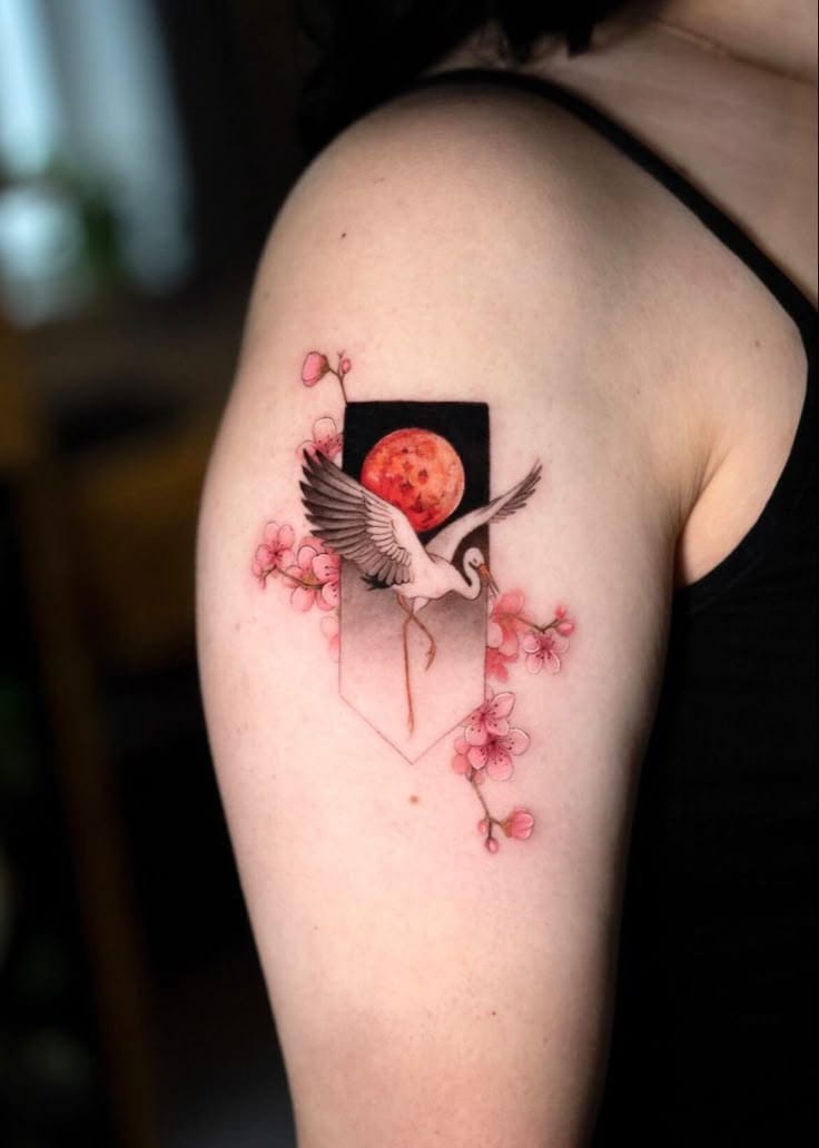 a small Japanese tattoo with a moon