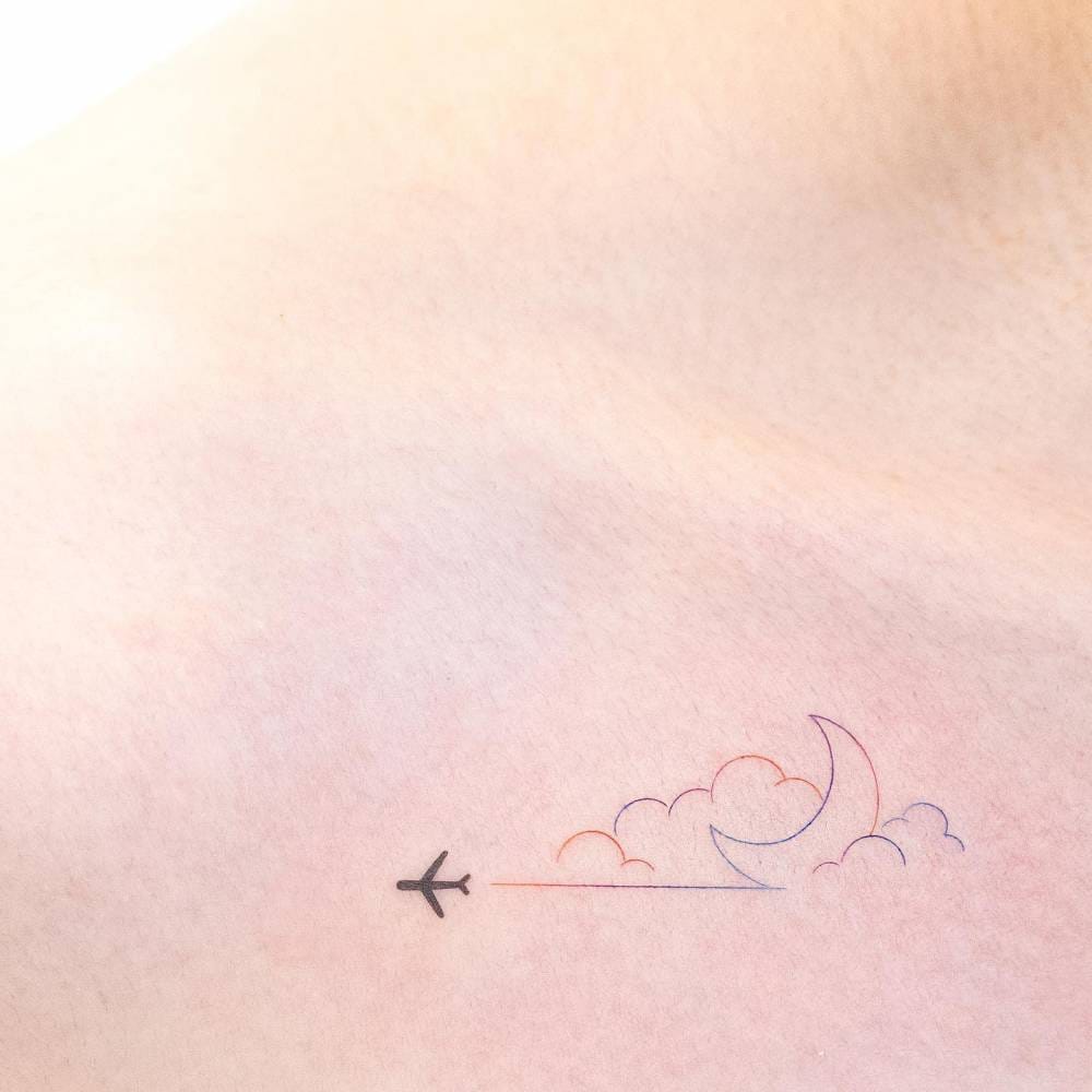 airplane and clouds tattoo