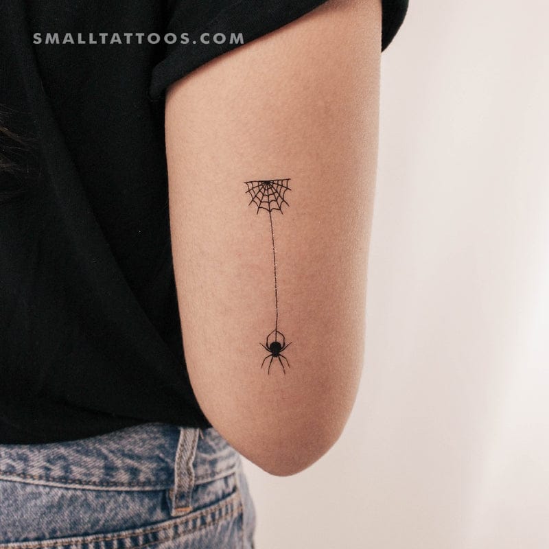 small spider web tattoo