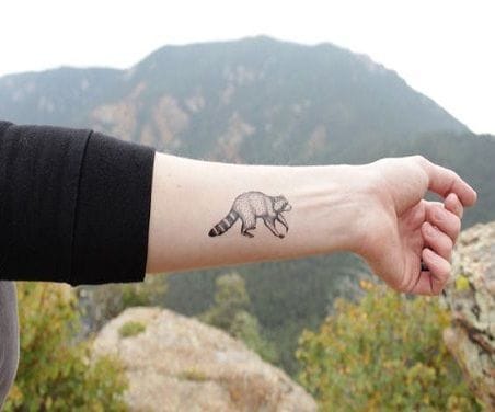 minimalist raccoon tattoo