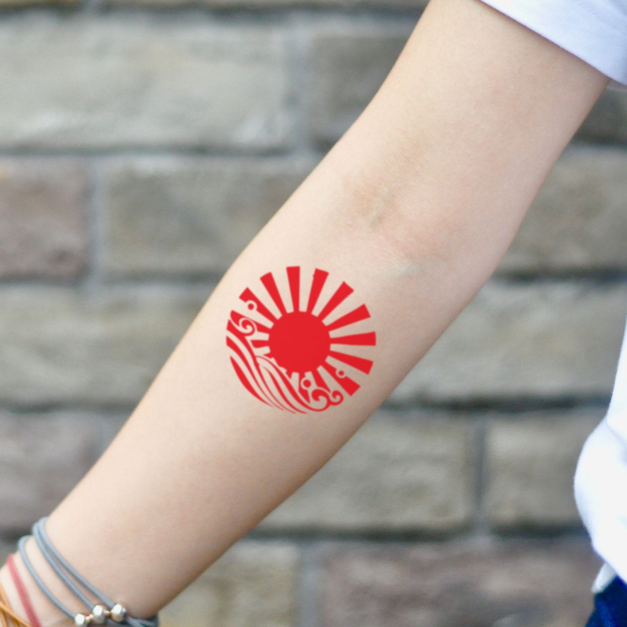a small Japanese sun tattoo design