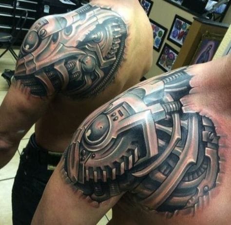 a muscular upper arm with biomechanical tattoo