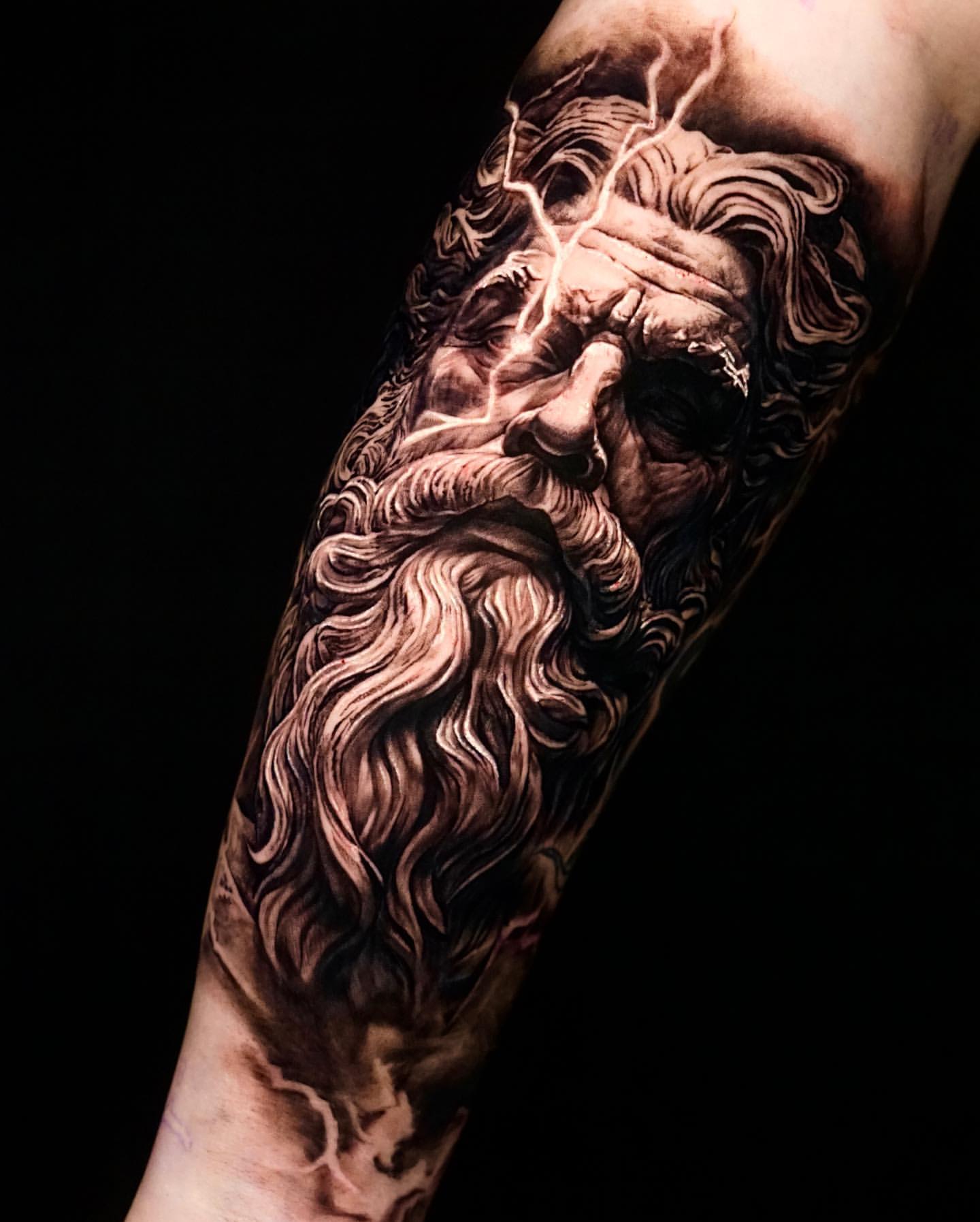 whimsical zeus arm tattoo