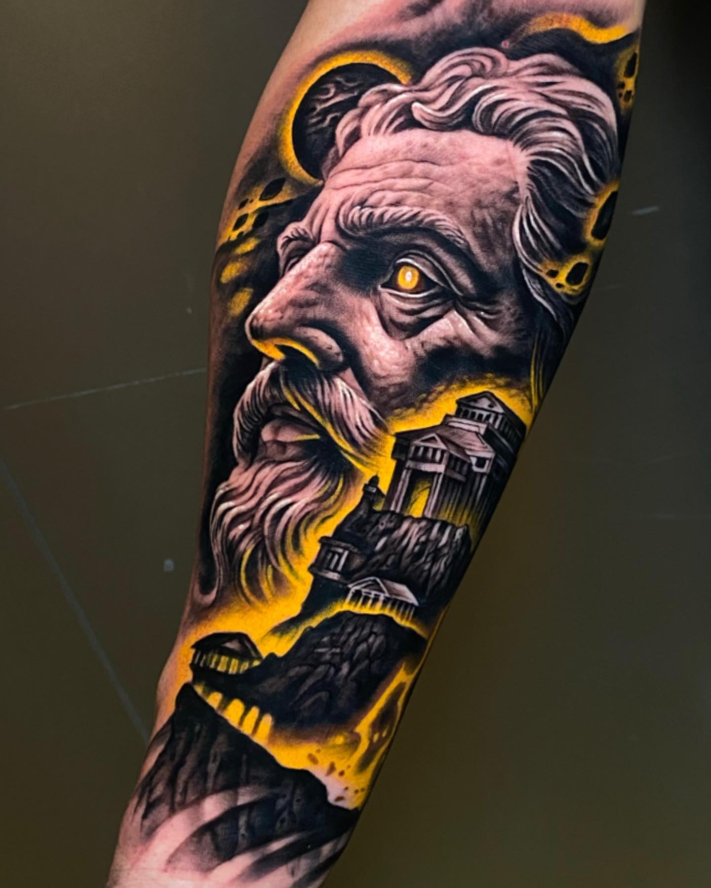 colorful zeus profile calf tattoo