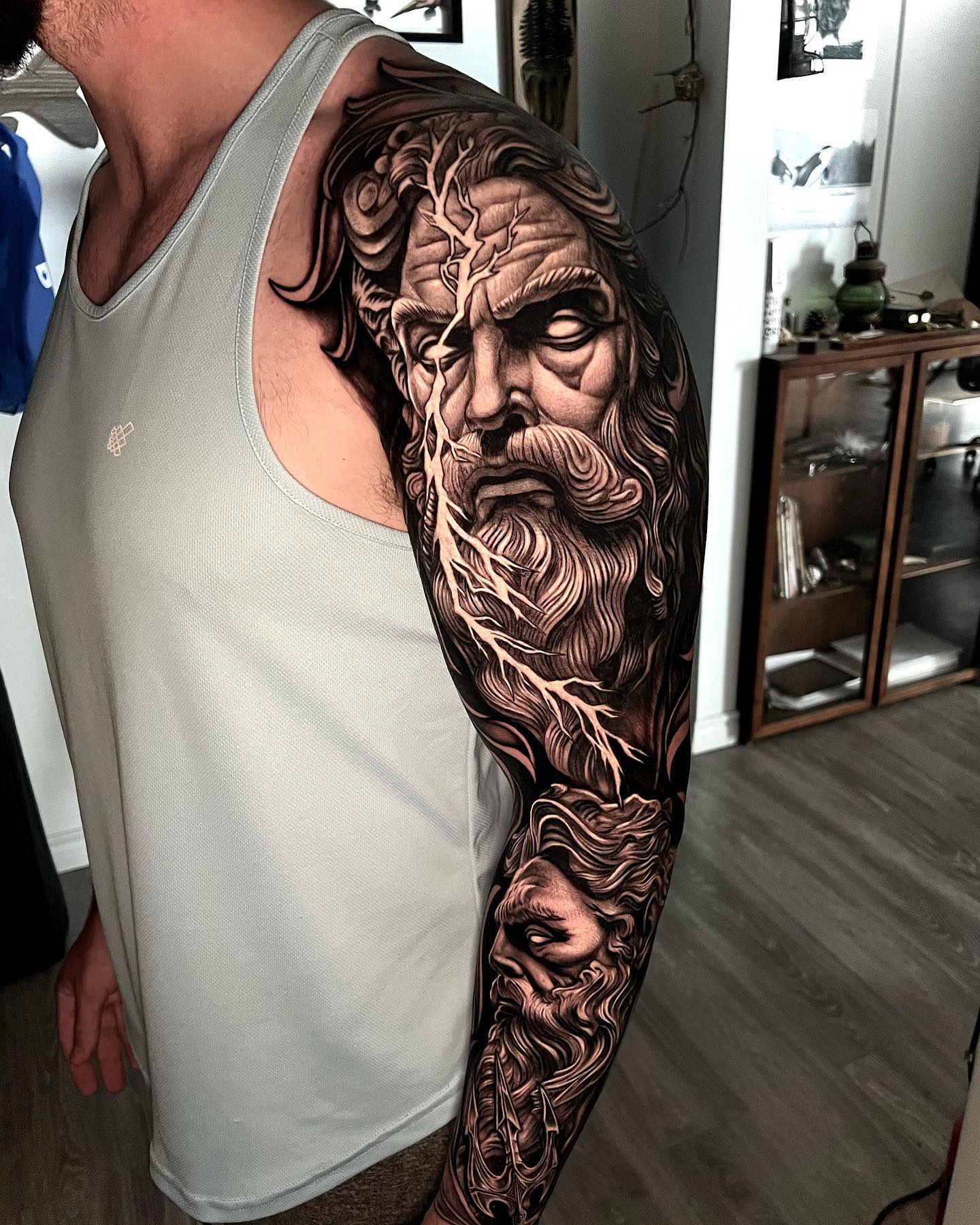 roaring zeus sleeve tattoo