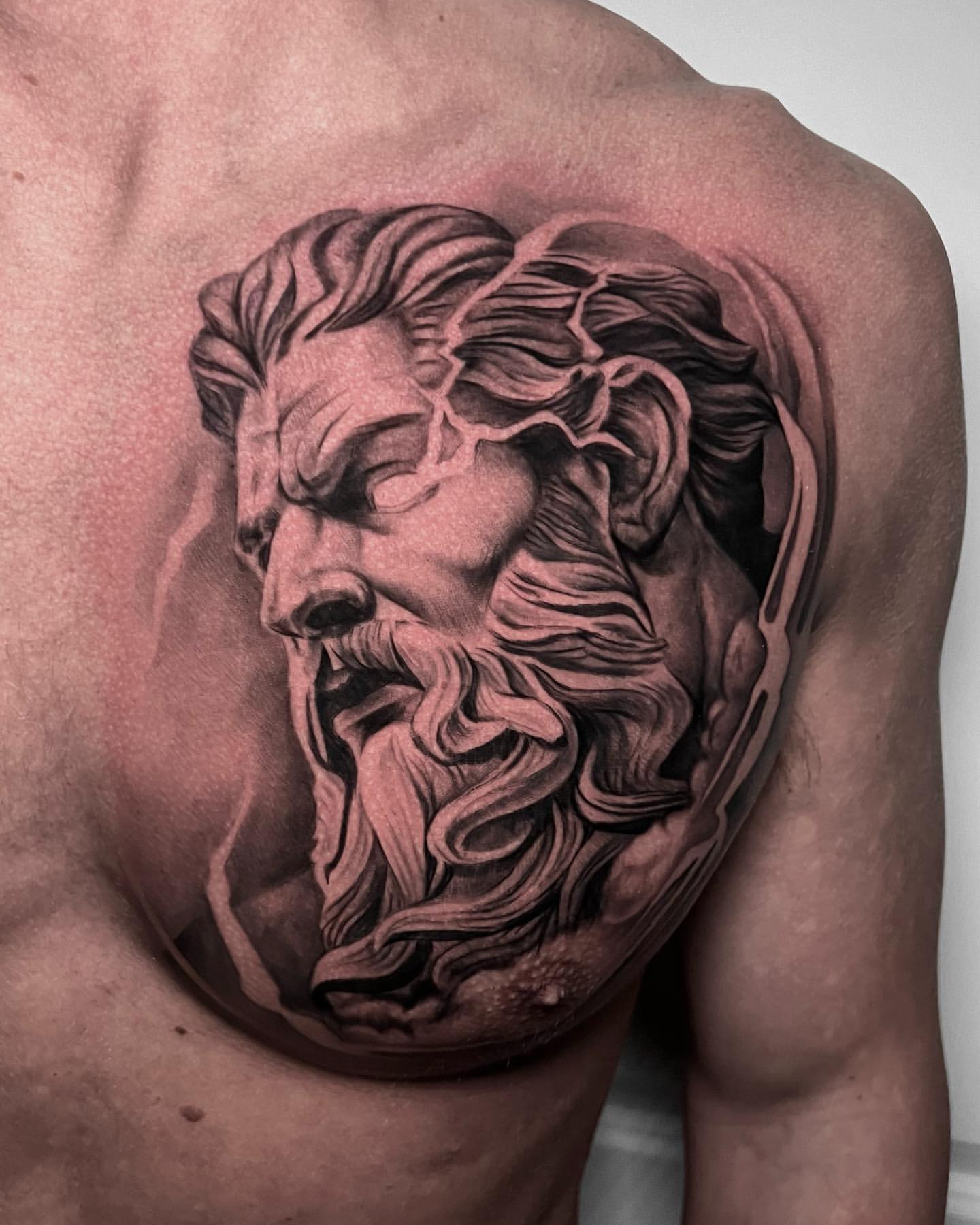 geometric zeus chest tattoo