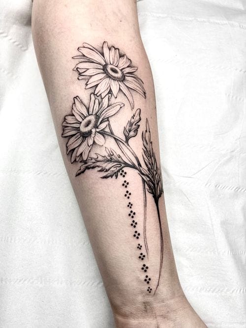 blackwork daisy tattoo