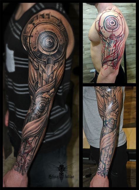 upper arm with biomechanical tattoo with metallic accents