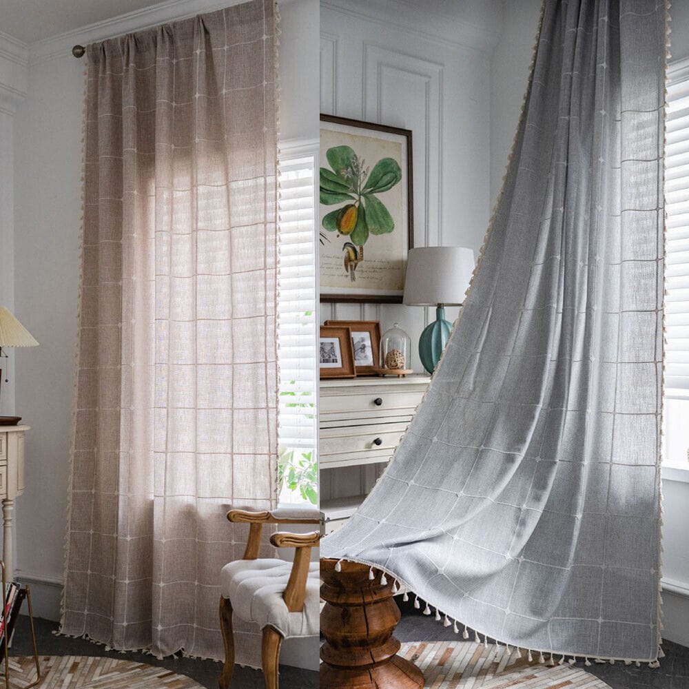 a living room with tasseled curtains