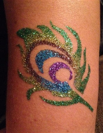 a dazzling glitter tattoo with a glitter feather