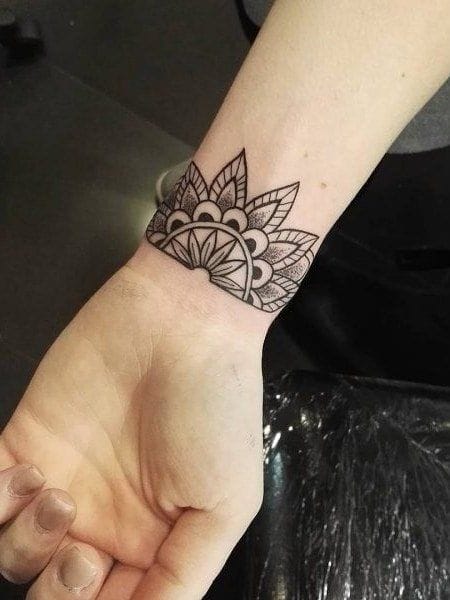 small wrist mandala tattoo
