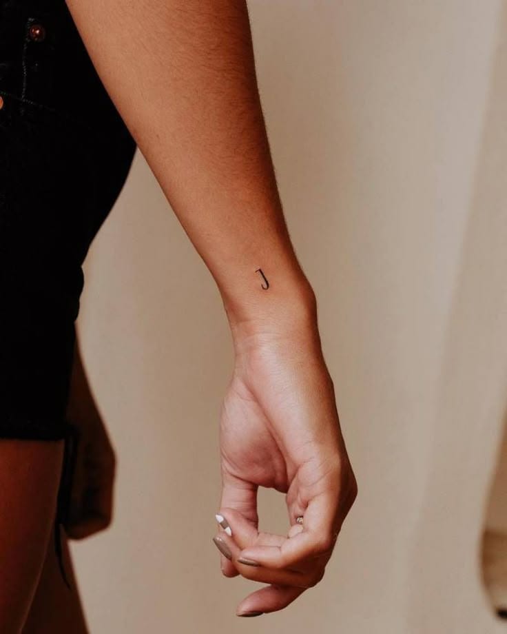 wrist placement j tattoo