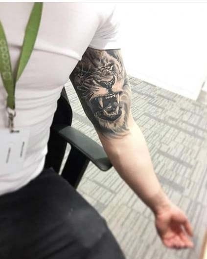 men's inner lion tattoo