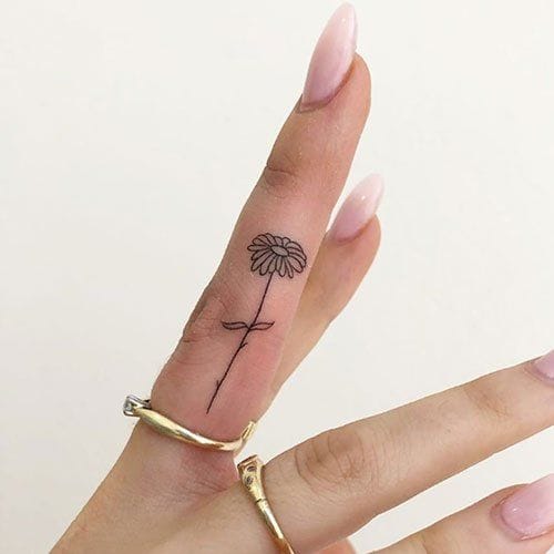 finger daisy tattoo