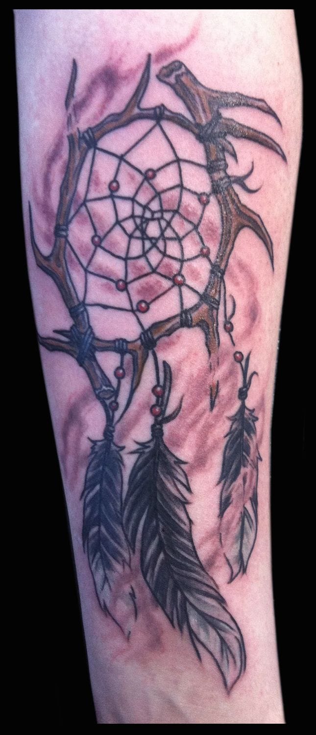 feather and spider web tattoo