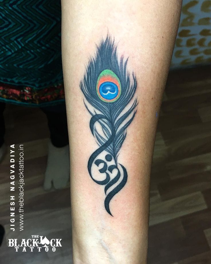 an Indian tattoo with peacock feathers