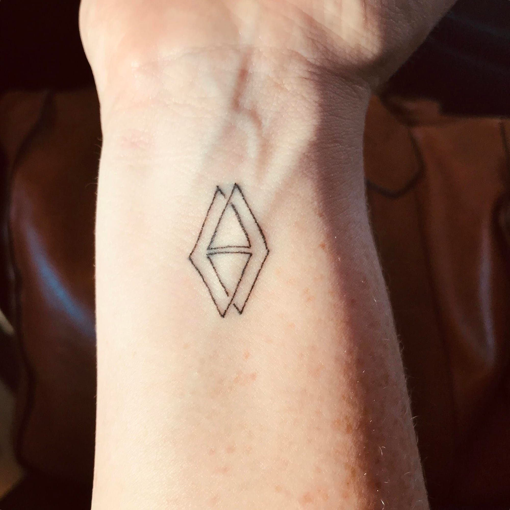 kid's symmetry tattoo