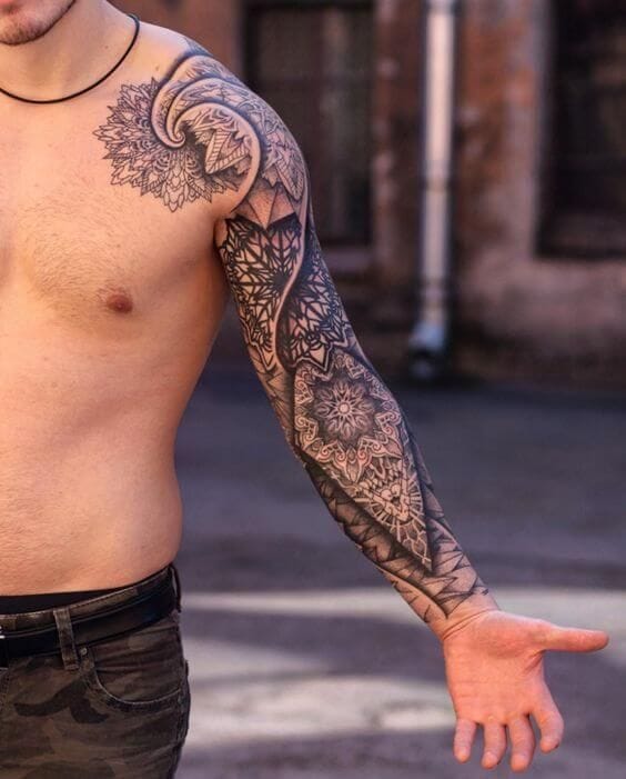 a muscular man's upper arm with mandala