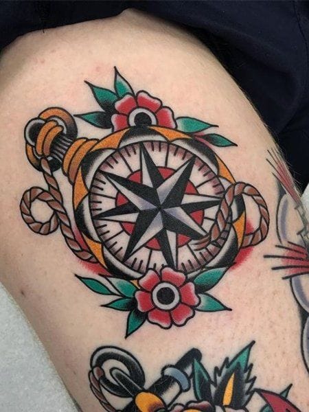 upper arm with nautical compass tattoo in traditional style