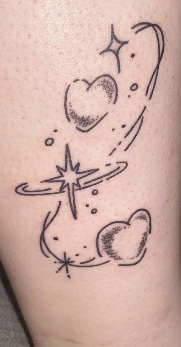 a dazzling glitter tattoo with sparkling heart design