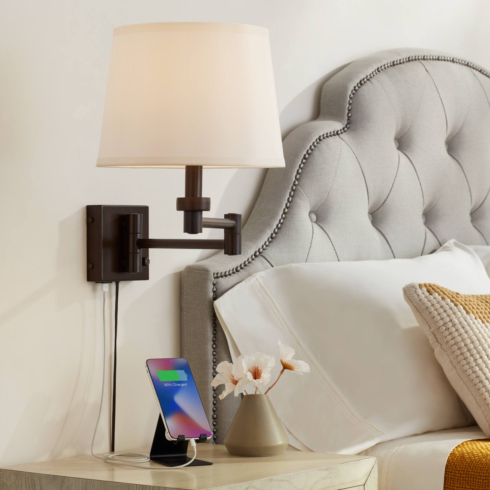 living room with wall lamps with integrated usb charging ports
