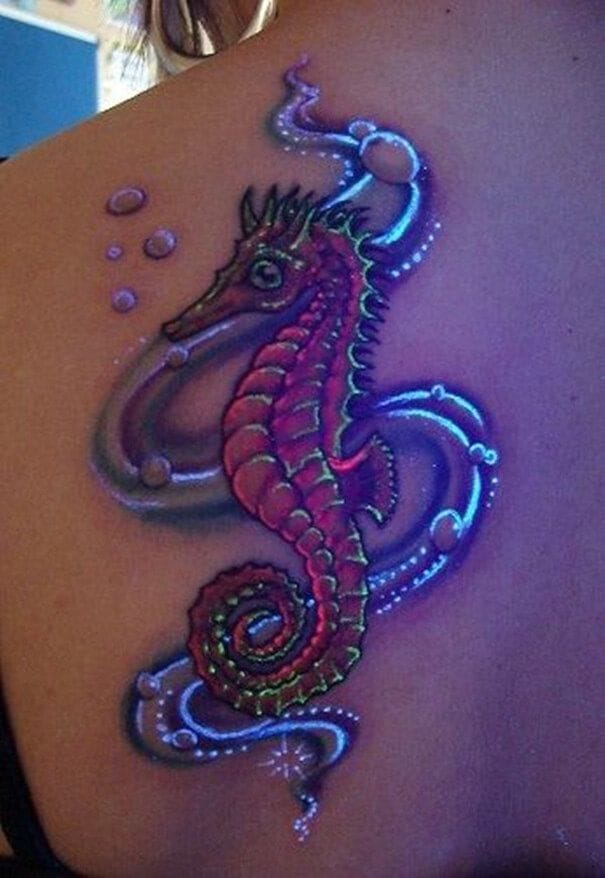 glowing seahorse tattoo