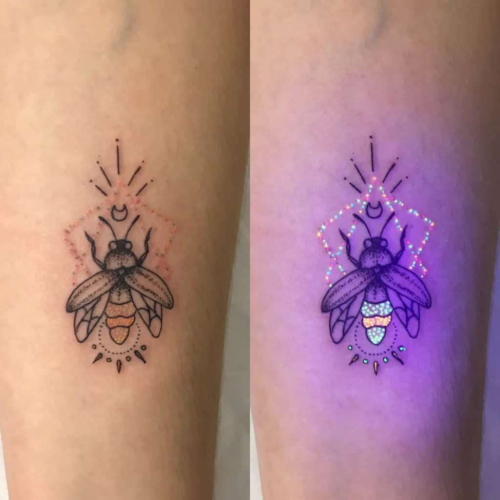 a glowing firefly tattoo with UV-reactive ink