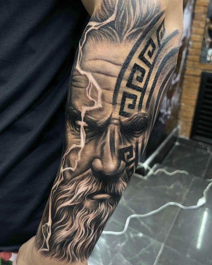 zeus in battle leg tattoo