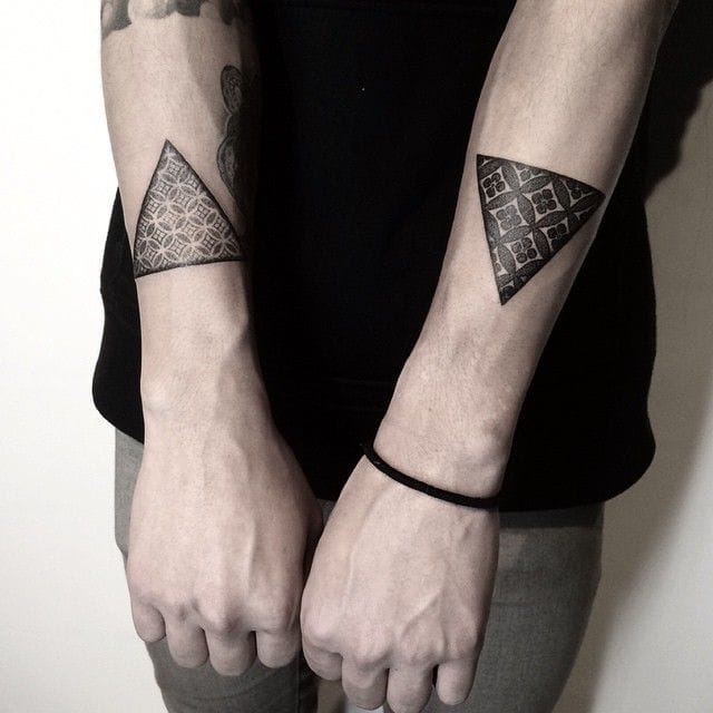 a small Japanese tattoo with geometric design