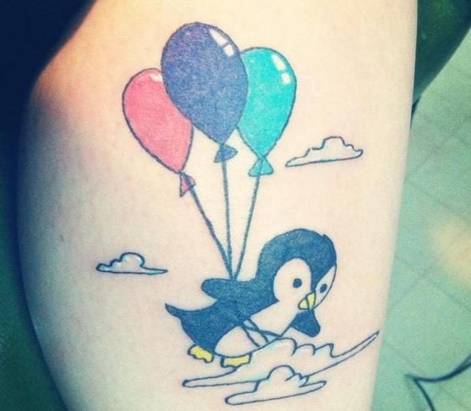 penguin with balloon tattoo