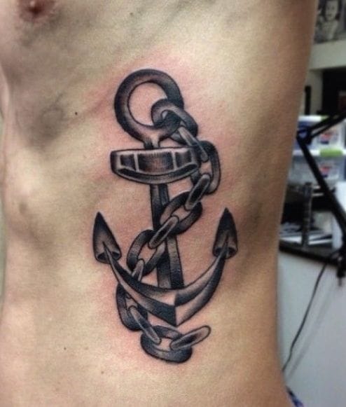 a cool ribs tattoo with anchor wheel