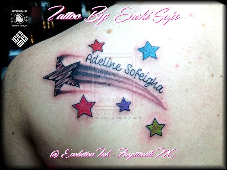 a beautiful shooting star tattoo with banner word