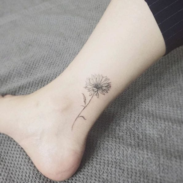 ankle daisy tattoo